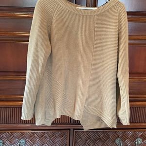 Spring knitted sweater. Semi open back with button closure.